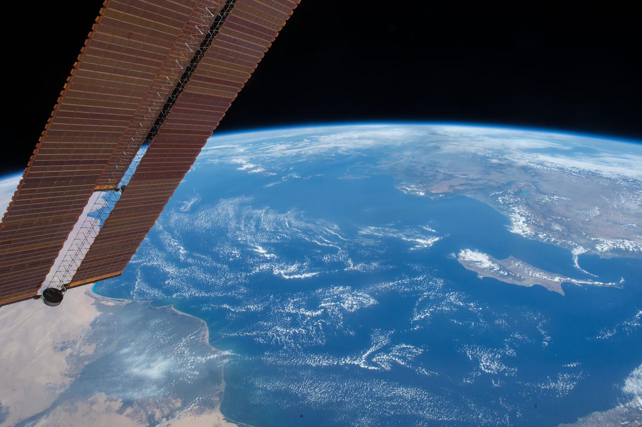 Earth observation (Mediterranean Sea) taken by the Expedition 45 crew. ISS solar array wings (SAWs) are in view. Image was released by astronaut on social media.