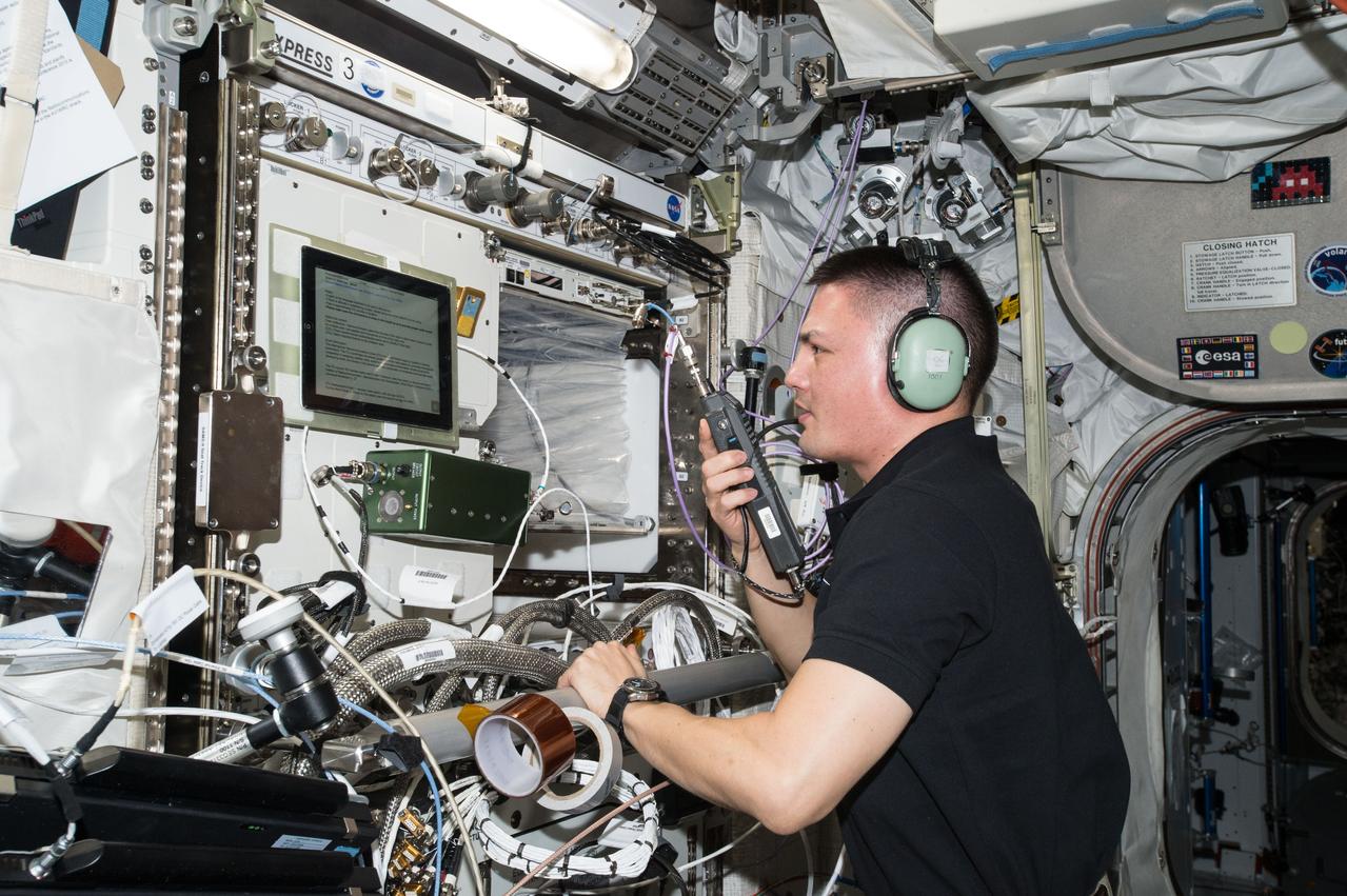 ISS045E089495 (11/04/2015) --- NASA astronaut Kjell Lindgren uses a HAM radio to speak with operators down on Earth. The International Space Station is equipped with amateur radio equipment allowing astronauts to share the excitement of space exploration, inspire and ignite interest among students and others on the ground.