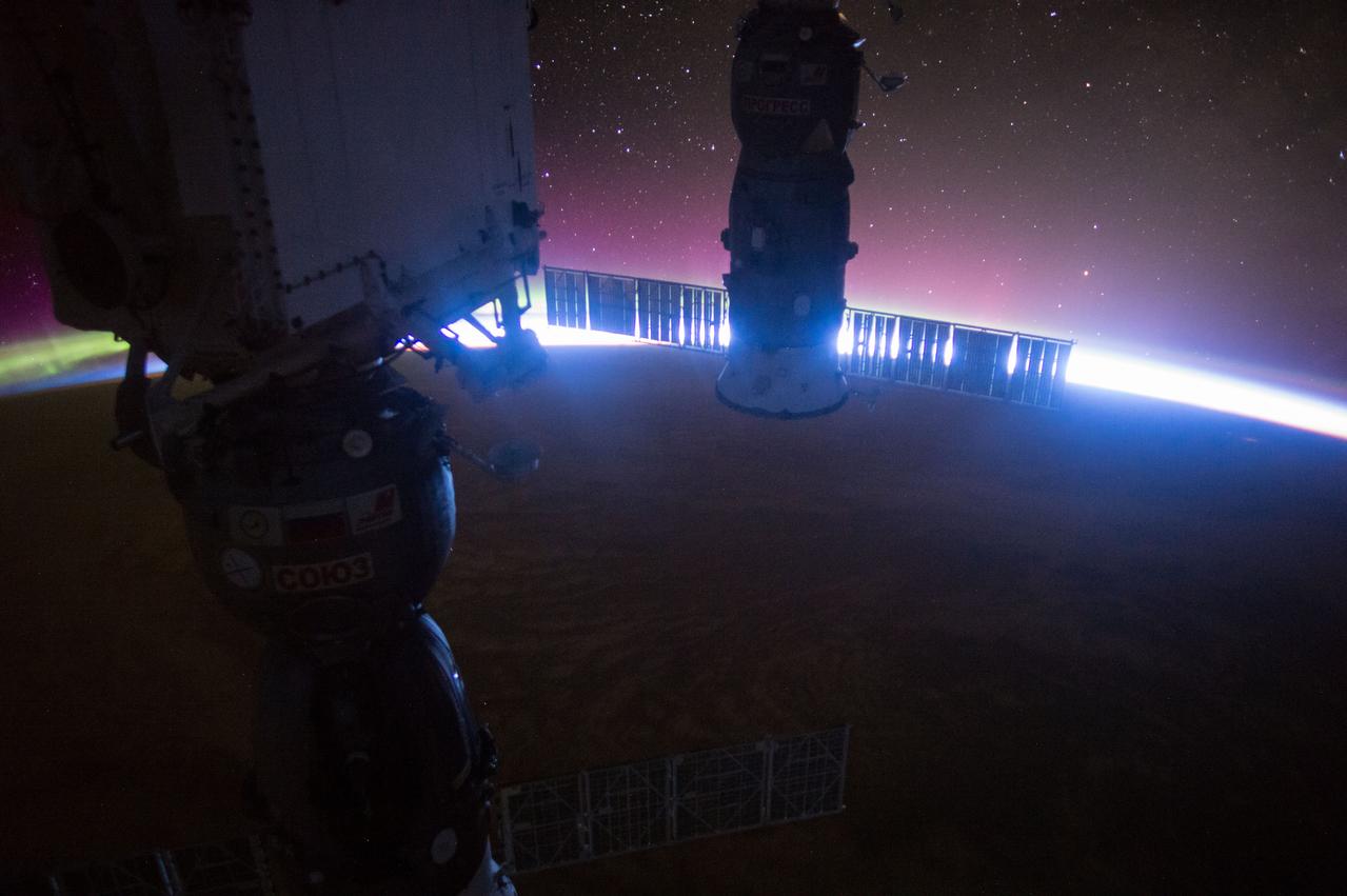 ISS045E108823 (11/17/2015) --- Sunrise as viewed from the International Space Station Nov. 17, 2015. Framing the brilliant edge of sun is the Soyuz TMA-17M (front) which brought NASA astronaut Kjell Lindgren, JAXA astronaut Kimiya Yui and Russian cosmonaut Oleg Kononenko to the station and the ISS Progress 60 (back) cargo craft which arrived back on July 5 with supplies, equipment & experiments.
