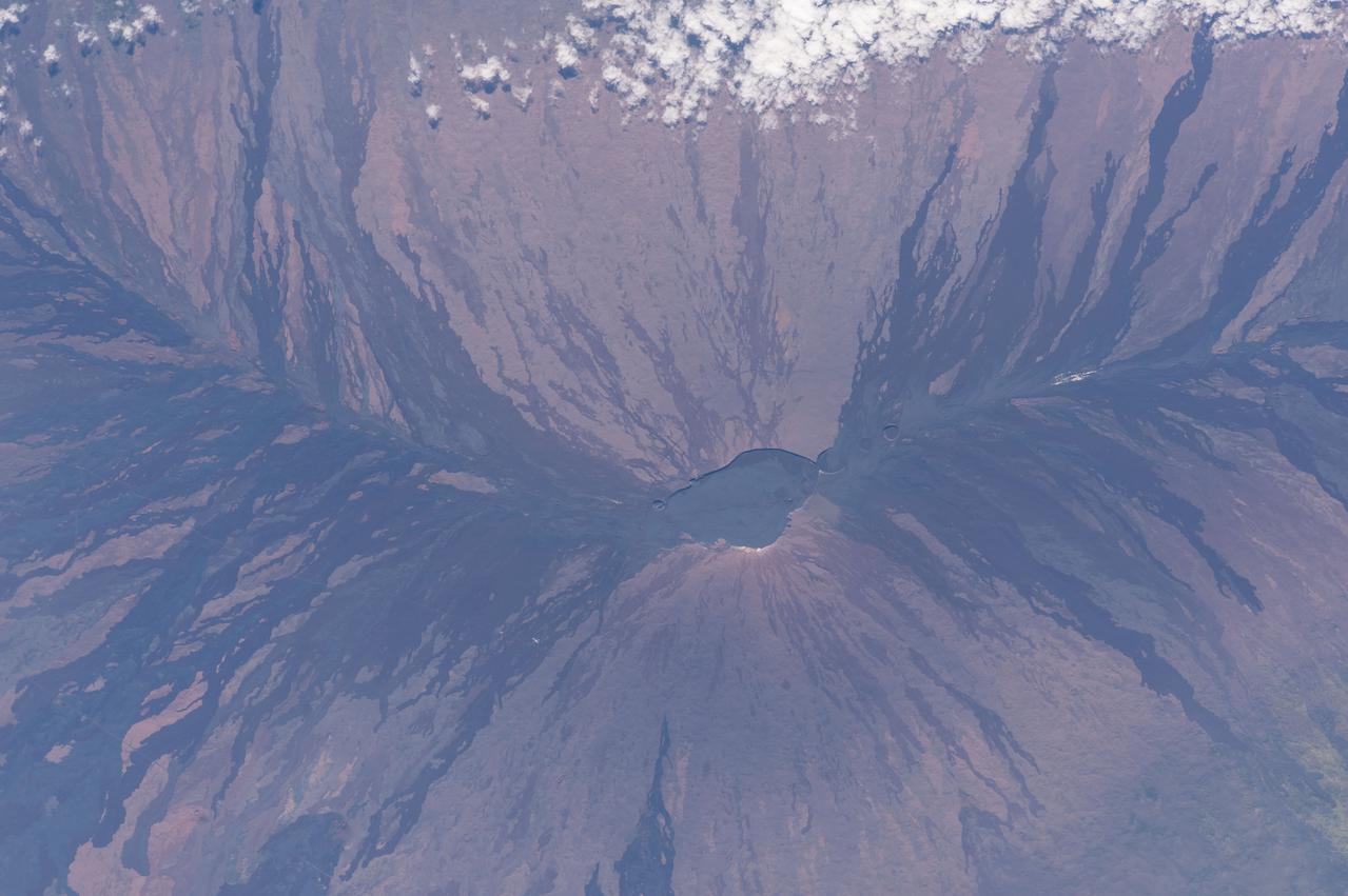 Earth observation (Mauna Loa, Hawaii) taken by the Expedition 45 crew. Image was released by astronaut on social media. "Lava flows splay out from Mauna Loa's caldera"
