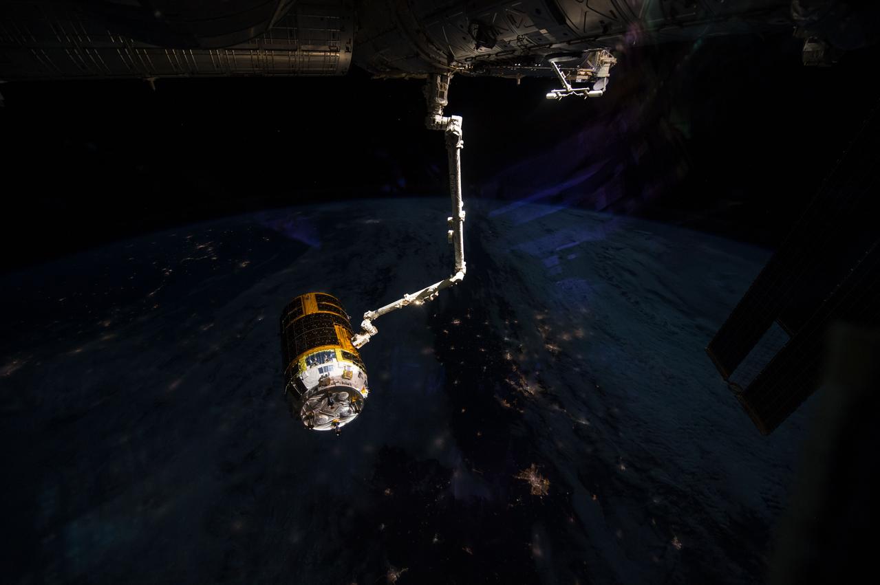 The unberthed Kounotori H-II Transfer Vehicle 5 (HTV-5) is grappled by the Canadarm2 Space Station Remote Manipulator System (SSRMS) prior to its release for reentry. This image is part of a time lapse sequence (iss045e125963 through iss045e126960) taken at a rate of 12 frames per minute. Image was released by astronaut on social media.