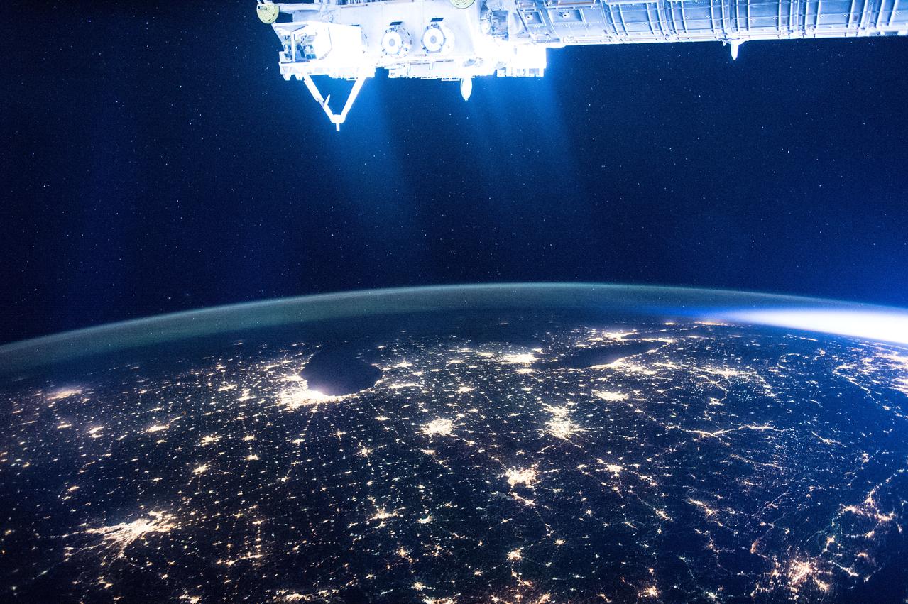 ISS046e005404 (01/05/2016) --- The glittering lights of the American Midwest illuminate the Earth in this captivating image taken by the International Space Station Expedition 46 crew on Jan. 5, 2016. The picture, which was taken while the station was flying above Alabama, shows numerous major cities, including the major city of Chicago (middle-left) situated on the Lake Michigan coastline. Also in view are three of the American Great Lakes, including Lake Michigan (left), Lake Huron (middle) and Lake Erie (right).