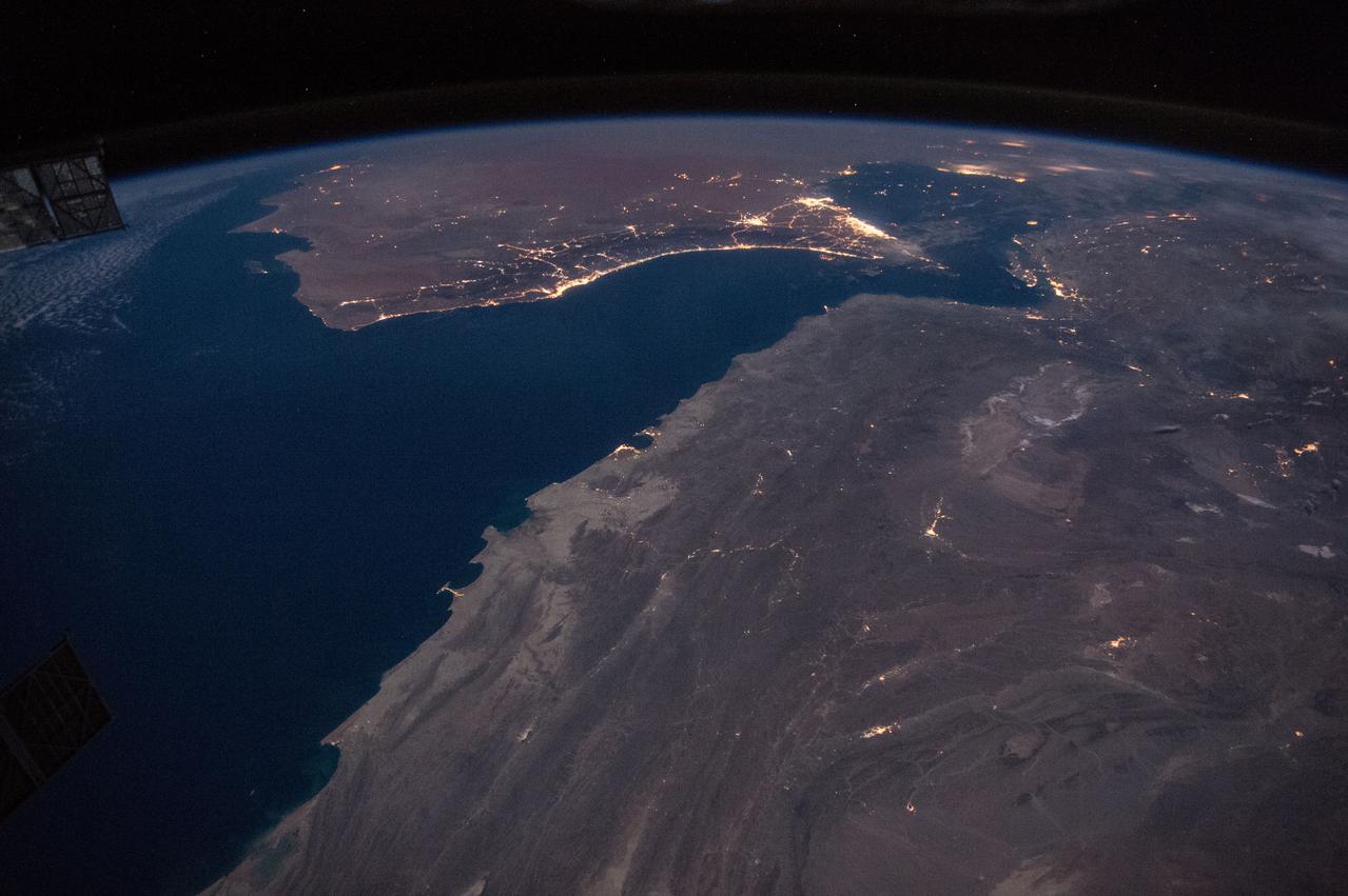 ISS046e021993 (01/23/2016) --- Earth observation of the coast of Oman taken during a night pass by the Expedition 46 crew aboard the International Space Station. NASA astronaut Tim Kopra tweeted this image out with this message: "Passing over the Gulf of #Oman at night -- city lights of #Muscat #Dubai #AbuDhabi and #Doha in the distance".
