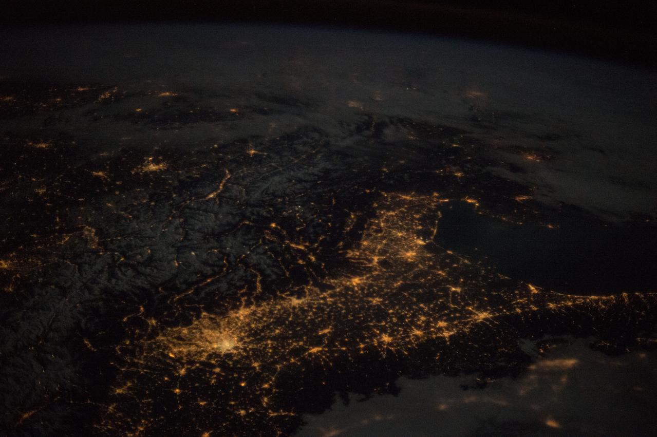 ISS046e024208 (01/25/2016) --- Expedition 46 flight engineer Tim Kopra of NASA shared this stunning nighttime photograph with his social media followers on Jan. 25, 2016, writing, "Beautiful night pass over Italy, Alps and Mediterranean."