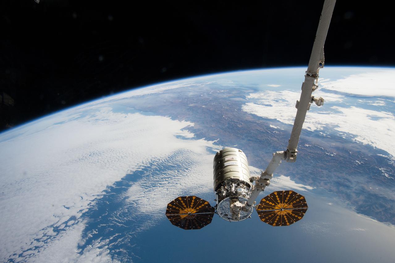 iss046e044208 (Feb. 19, 2016) --- The Orbital ATK Cygnus spacecraft is grappled by the Canadarm2 after being unberthed from the Unity module Earth-facing port. The International Space Station was orbiting 258 miles above the Pacific coast of Chile.
