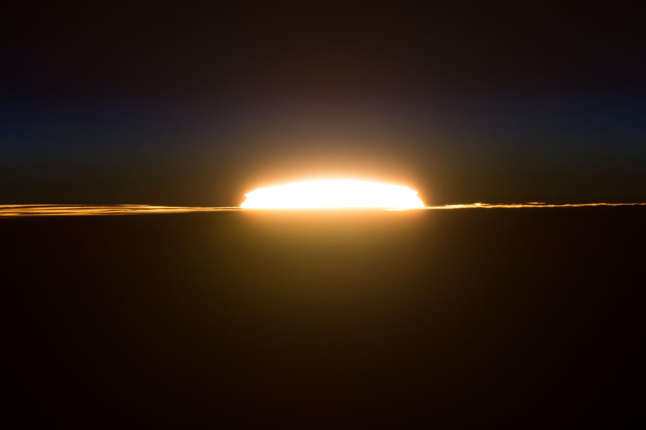 iss046e050011 (02/27/2016) --- The sun rises slowly on Feb 27, 2016  as the International Space Station continues its course around the Earth. Expedition 46 crew members snapped this image.