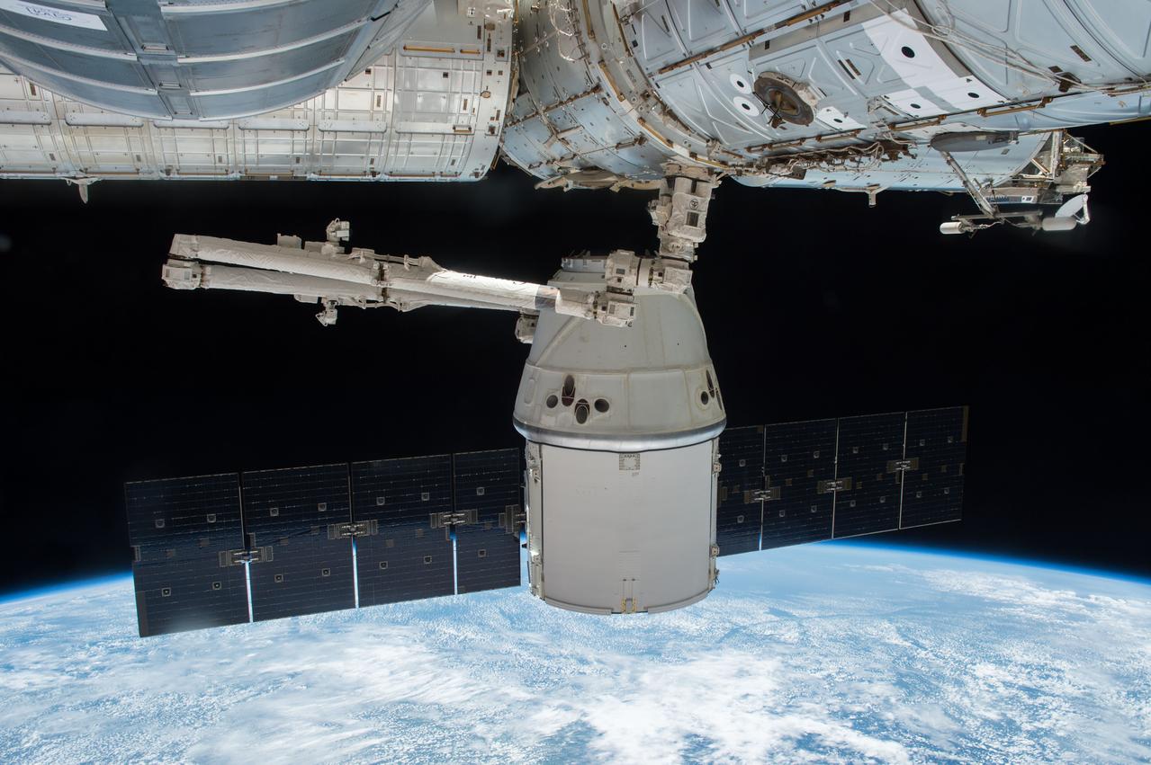 ISS047e109559 (05/11/2016) --- The SpaceX Dragon is seen berthed to the Earth-facing side of the station’s Harmony module shortly before departure. The vehicle was ultimately released by Expedition 47 robotic arm operator Tim Peake of ESA (European Space Agency) at 9:18 a.m. EDT. Dragon returned to Earth carrying more than 3,700 pounds of NASA cargo and science samples from human research, biology and biotechnology studies, physical science investigations and education activities sponsored by NASA and the U.S. national laboratory.