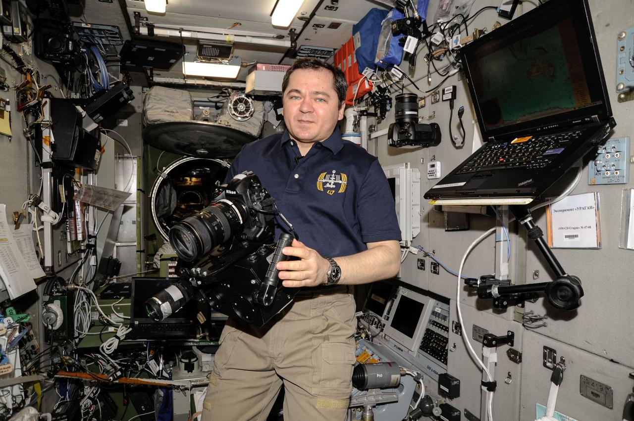 ISS047e132751 (05/24/2016)  --- Russian cosmonaut Oleg Skripochka readies a high power camera for the DUBRAVA experiment, which is testing methods for tracking natural and man-made impacts on forest cover from the International Space Station. It will use both visual and spectrometric tools to monitor at first with the potential for adding hyperspectral and infrared equipment in the future.