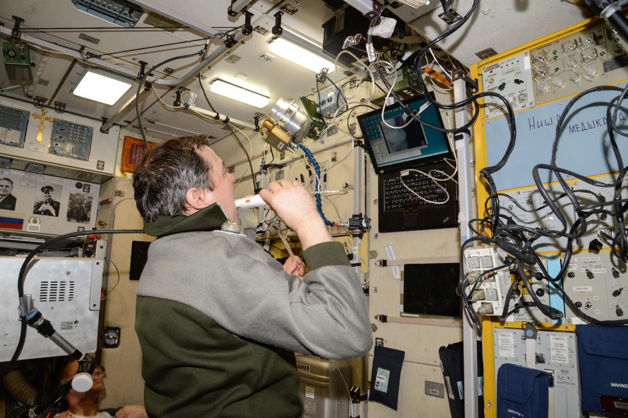 iss047e136529 (6/2/2016) --- A view of Cosmonaut Oleg Skripochka, during a BIMS Experiment session in the Service module aboard the International Space Station (ISS). The Study of Processes for Informational Support of In-Flight Medical Support using an Onboard Medical Information System Integrated into the Information Control System of the ISS Russian Segment (BIMS) uses telemedicine technologies to collect information by non-contact means from the ear, nose, and throat (ENT), gums, teeth, and small areas of skin from International Space Station (ISS) crews for medical support of manned spaceflights and in-flight biomedical research.