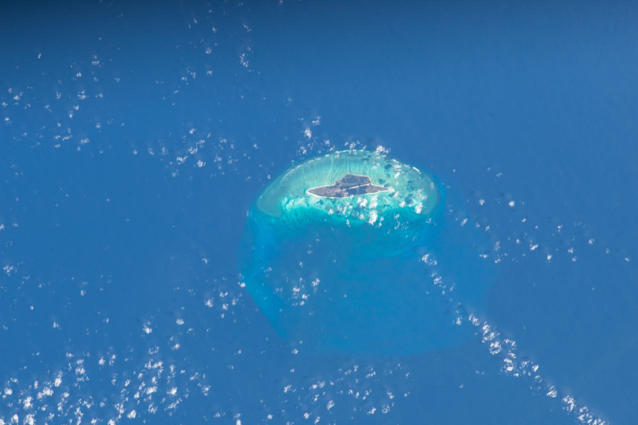 ISS047e141619 (06/06/2016) --- This Earth observation image captured by Expedition 47 members aboard the International Space Station is of Juan de Nova Island, also known as Saint-Christophe. The small French tropical island is in the narrowest part of the Mozambique Channel, about one-third of the way between Madagascar and Mozambique. The Island is 3.7 miles long and 1 mile at its widest. It is a nature reserve surrounded by reefs. Forests cover about half the island and sea turtles nest on the beaches. It is largely uninhabited but the French maintain a weather station on the Island.