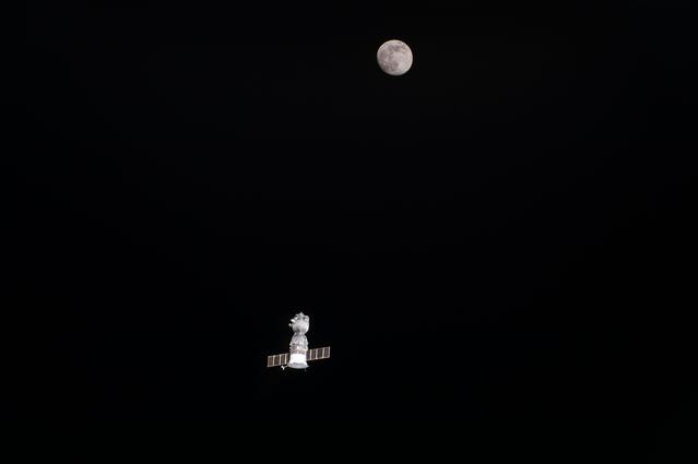 NASA image: Departing Soyuz TMA-19 and the Moon
