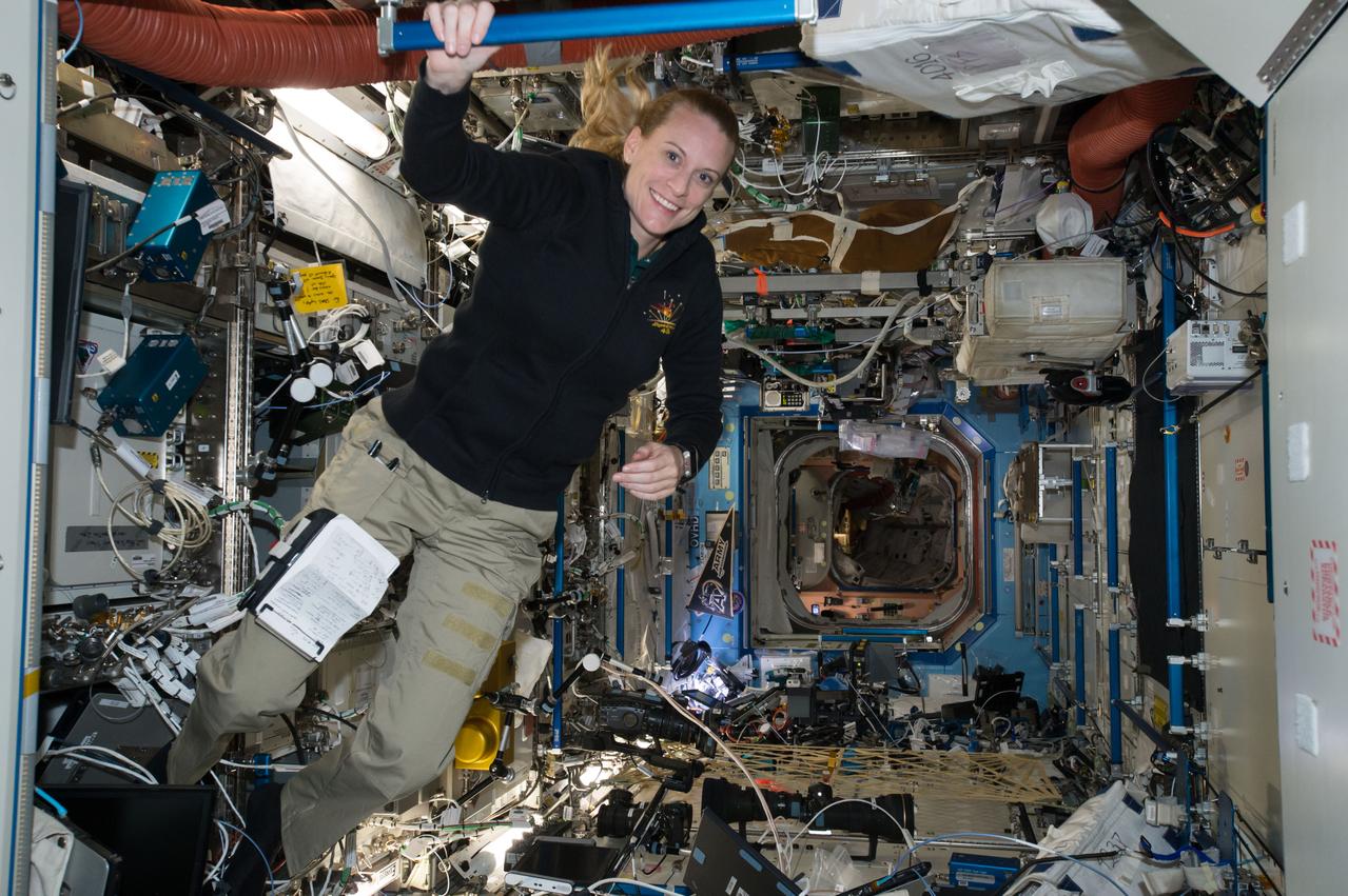 ISS048e025433 (07/12/2016) --- NASA astronaut Kate Rubins floats in front of a hatch of the U.S. Destiny laboratory aboard the International Space Station. Rubins launched to the station on July 6, 2016 and arrived two days later. She will serve as a flight engineer for Expeditions 48/49 and is currently scheduled to return home at the end of October.