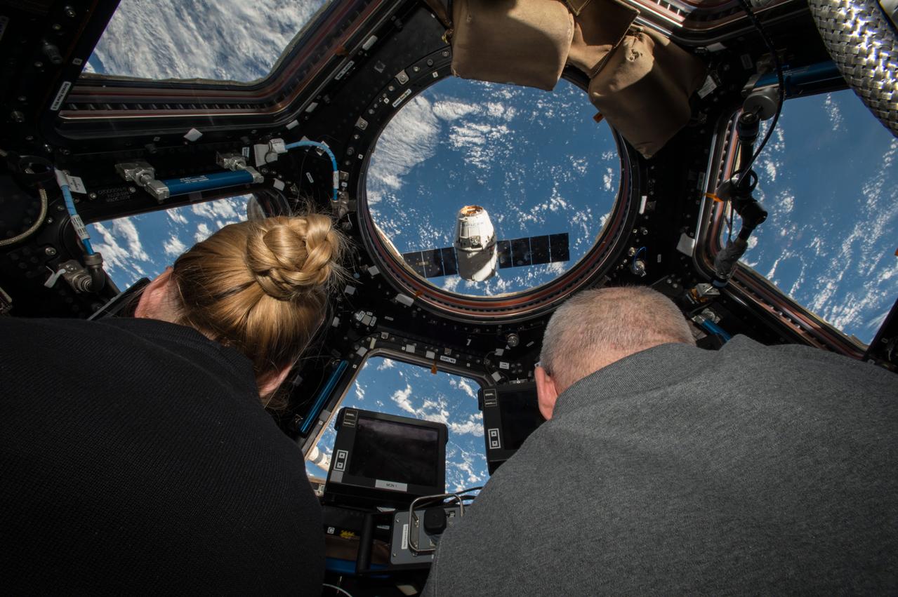 ISS048e041836 (07/20/2016) --- NASA astronauts Kate Rubins (left) and Jeff Williams (right) prepare to grapple the SpaceX Dragon supply spacecraft from aboard the International Space Station. The nearly 5,000 pounds of supplies and equipment includes science supplies and hardware, including instruments to perform the first-ever DNA sequencing in space, and the first of two identical international docking adapters (IDA.) The IDAs will provide a means for commercial crew spacecraft to dock to the station in the near future as part of NASA’s Commercial Crew Program. Dragon is scheduled to depart the space station Aug. 29 when it will return critical science research back to Earth.