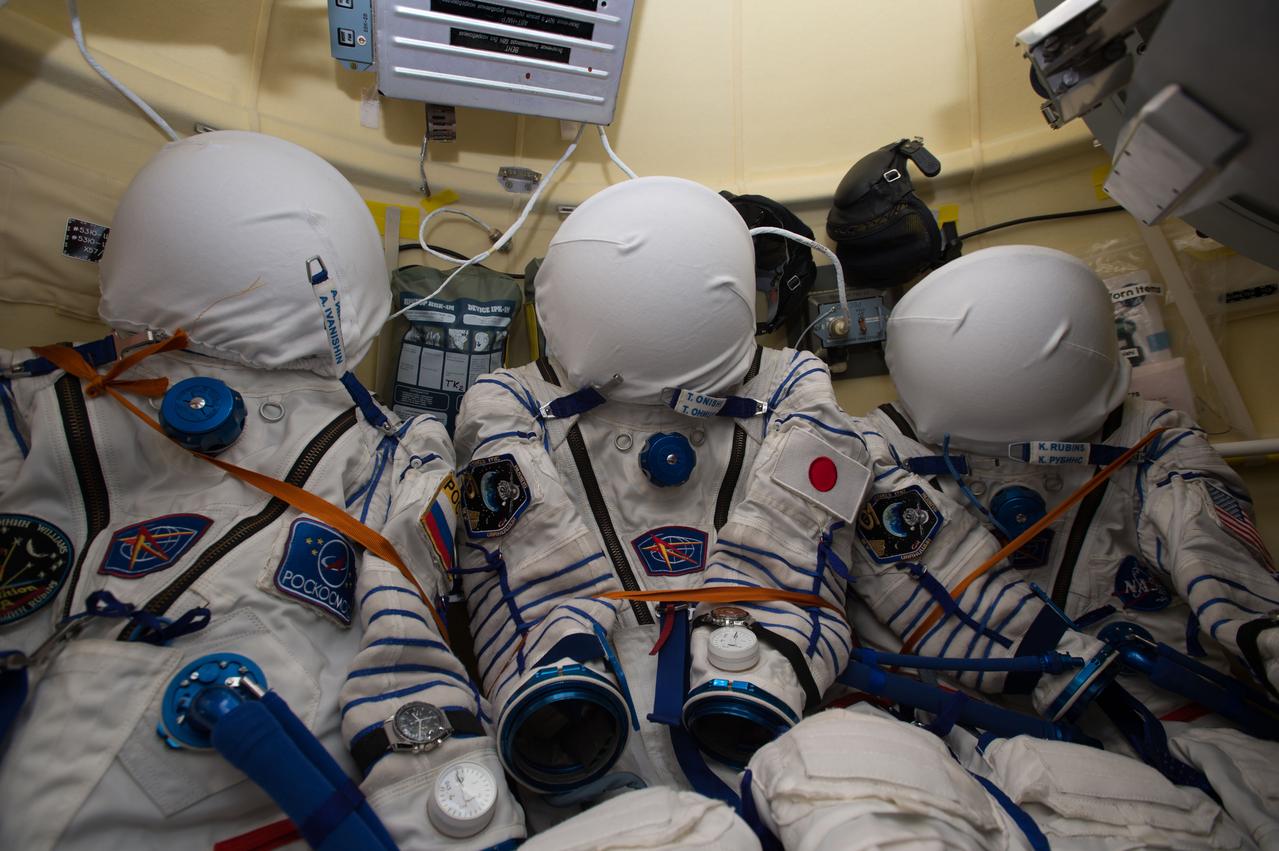 iss048e045920 (07/30/2016) --- The Sokol launch and entry suits for the crew of the Soyuz MS-01 spacecraft are seen in storage onboard the docked ship. Suits for Expedition 48-49 crewmembers Anatoly Ivanishin of Roscosmos (left), Japanese astronaut Takuya Onishi of the Japan Aerospace Exploration Agency (middle) and Kate Rubins of NASA (right) are visible.