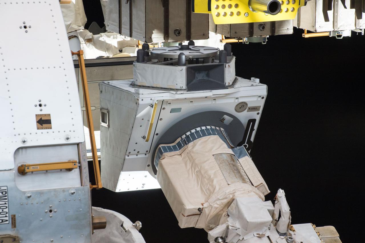 iss048e049789 (8/5/2016) --- A view of the NanoRacks External Platform (NREP) grappled by the Japanese Experiment Module Remote Manipulator System (JEMRMS) during operations to transfer the NREP to the JEM (Japanese Experiment Module) Exposed Facility (JEF). The NREP contains the NanoRacks-Gumstix and NanoRacks NanoTube Solar Cell payloads. The NanoRacks External Platform is a compact research platform fitted for versatile use on the exterior of the International Space Station (ISS).