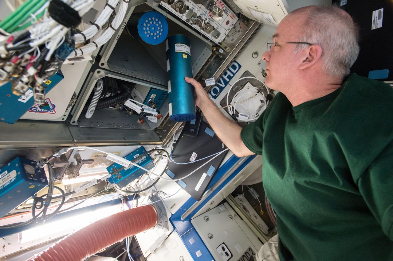iss048e049824 (8/5/2016) --- NASA astronaut Jeff Williams transfers two canisters for the Biological Research in Canisters - Natural Product under Microgravity (BRIC-NP) experiment to ExPRESS (Expedite the Processing of Experiments to Space Station) Rack 2 Locker 6, LAB1O1-D2, in the Destiny U.S. Laboratory aboard the International Space Station (ISS). In the BRIC-NP investigation, fungal strains isolated from the Chernobyl nuclear power plant (ChNPP) accident are screened for the secretion of natural products that could be beneficial for biomedical and agricultural applications.