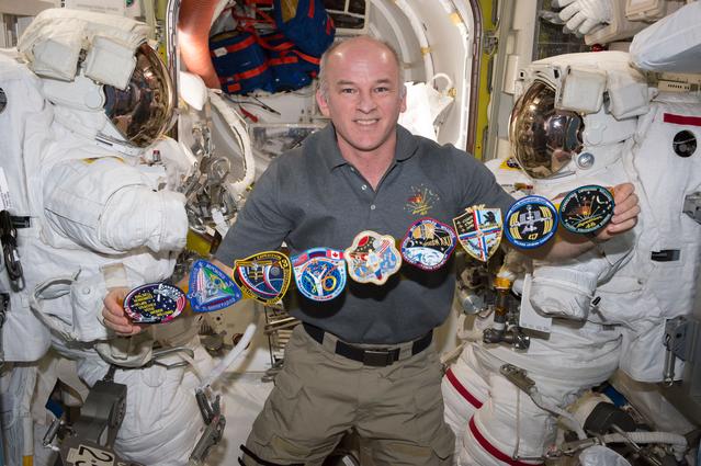 NASA image: Williams with Mission Patches in the A/L