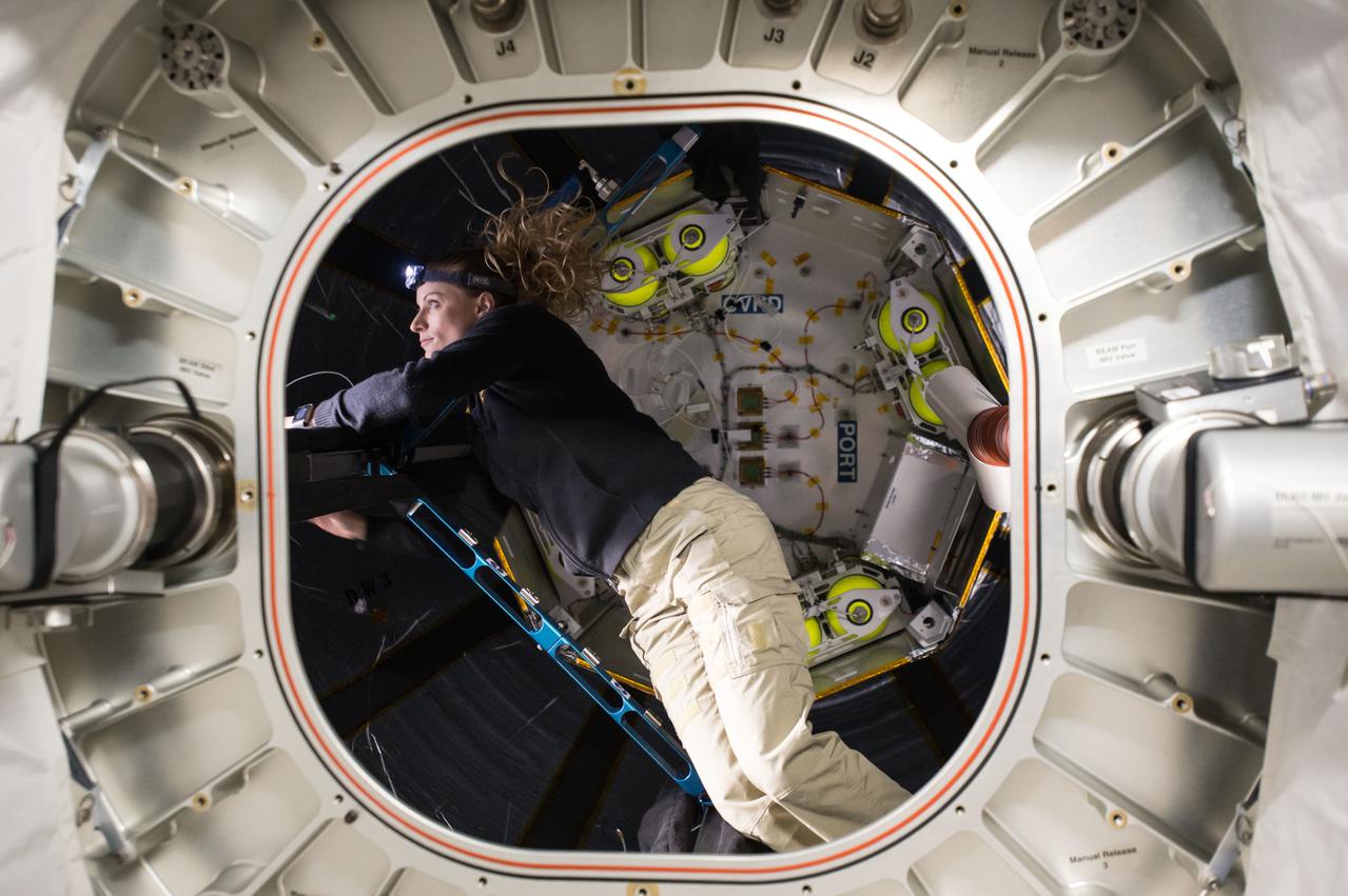 iss048e069952 (9/6/2016) --- NASA astronaut Kate Rubins is photographed inside the Bigelow Expandable Activity Module (BEAM) during BEAM ingress operations (OPS). The Bigelow Expandable Activity Module (BEAM) is an experimental expandable capsule that docks with the International Space Station (ISS). After docking, BEAM inflates to roughly 13 feet long and 10.5 feet in diameter to provide a habitable volume where a crew member can enter.
