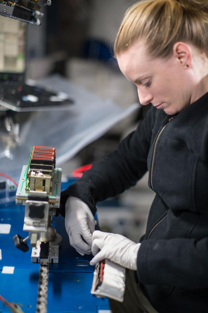 iss049e008866 (9/23/2016) --- NASA astronaut Kate Rubins is photographed performing the second harvest of the Plant RNA Regulation experiment by removing the European Modular Cultivation System (EMCS) Seed Cassettes from EMCS Rotors A and B stowing them in an EMCS Cold Stowage Pouch. The Plant RNA Regulation investigation studies the first steps of gene expression involved in development of roots and shoots. Scientists expect to find new molecules that play a role in how plants adapt and respond to the microgravity environment of space, which provides new insight into growing plants for food and oxygen supplies on long-duration missions.