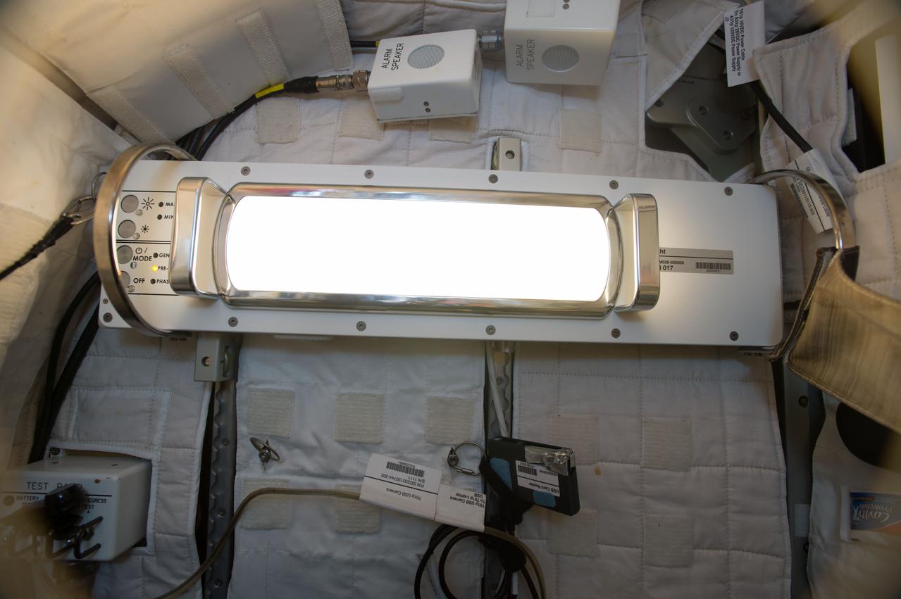 iss049e028948 (10/5/2016) --- Photographic documentation taken during Solid State Lighting Assembly (SSLA) Installation in the starboard Crew Quarters (CQ). The SSLAs were designed to replace General Luminaire Assemblies (GLAs) to improve visual acuity and to provide a crew health countermeasure for circadian rhythms, sleep, alertness and performance. Lighting Effects studies new light sources that can be adjusted for intensity and wavelength across the day, simulating a more regular schedule. Results are expected to provide new information for flight surgeons, psychologists, and crew members to better regulate circadian rhythms and improve sleep.