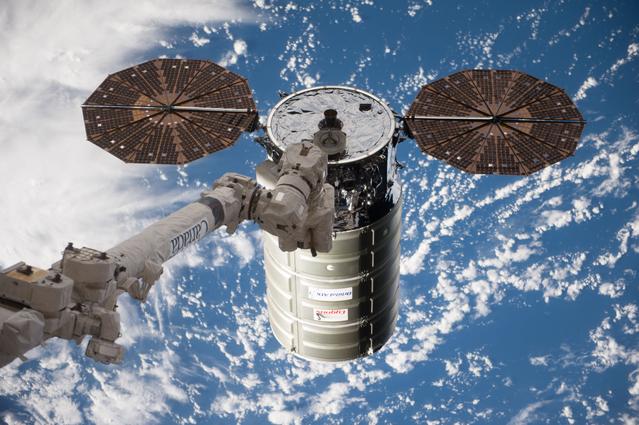 NASA image: Cygnus space vehicle during capture by SSRMS