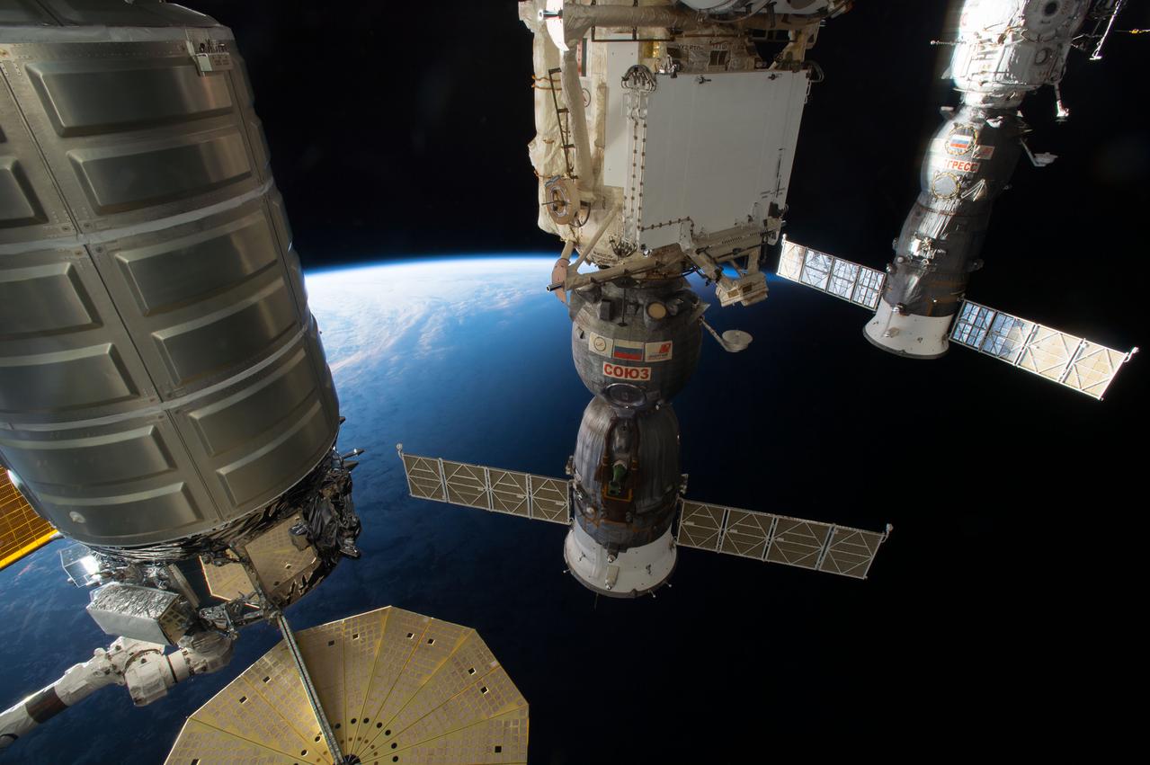 ISS049e042858 (10/23/2016) --- Three vehicles are photographed while simultaneously attached to the International Space Station. They include Orbital ATK’s Cygnus cargo craft (left), the Russian Soyuz MS-01 vehicle (middle) which delivered crew members Kate Rubins, Takuya Onishi and Anatoly Ivanishin to space, and the Russian Progress 64 cargo craft (right.)