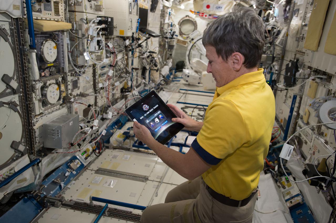 iss050e011454 (11/23/2016) --- A view of NASA astronaut Peggy Whitson using an iPAD containing the Dose Tracker application, in the Japanese Experiment Module (JEM) aboard the International Space Station (ISS). This study documents the medication usage of crew members before and during their missions by capturing previously unrecorded data regarding medication use during spaceflight, including side effect qualities, frequencies and severity. This research-oriented data is collected for research purposes, separate from medical records.