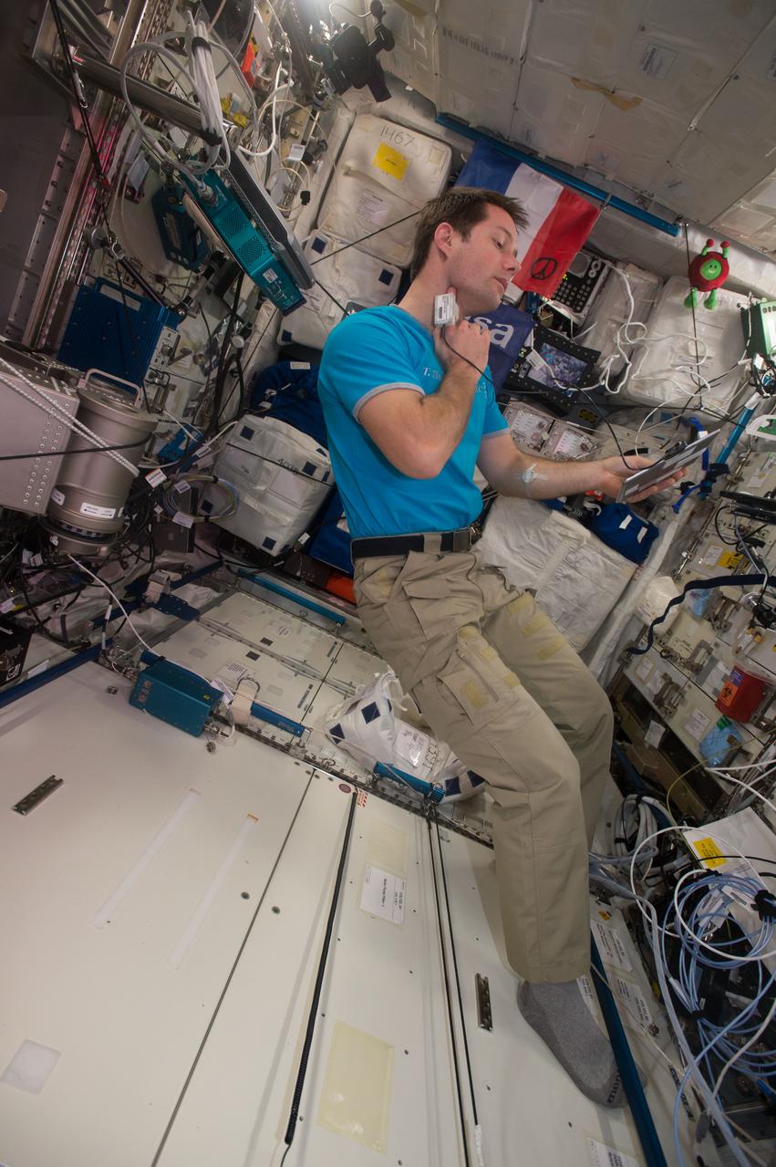 iss050e014804 (12/7/2016) --- European Space Agency (ESA) Thomas Pesquet wearing sensor (Tonometer) connected to iPad during EVERYWEAR experiment, in the Columbus Module. The EveryWear system is an ambulatory data collection system making use of wearable sensors connected to a station iPad itself wirelessly synchronized with ground. This easy-use system should demonstrate extensive physiology data collection for both science and medical follow-up purpose by improving usability for the astronauts.