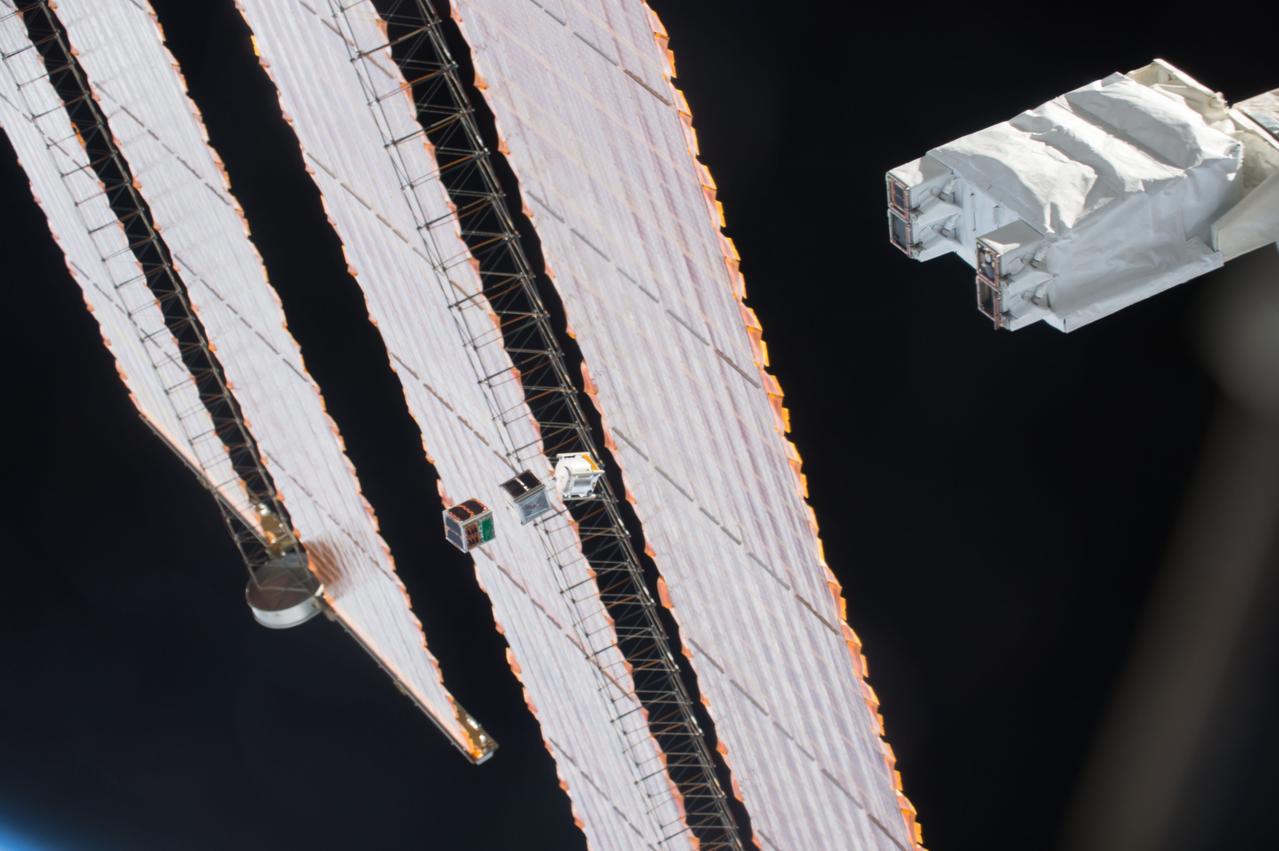 iss050e031207 (1/6/2017) --- A view during the Japanese-Small Satellite Orbital Deployer-6 (J-SSOD-6) deployment of the following satellites: Freedom (1U), Waseda-SAT3, ITF-2 (1U), Egg (3U), AOBA-Velox-III (U), TuPOD (3U). J-SSOD is a unique satellite launcher, handled by the Japanese Experiment Module Remote Manipulator System (JEMRMS), which provides containment and deployment mechanisms for several individual small satellites. Once the J-SSOD including satellite install cases with small satellites are installed on the Multi-Purpose Experiment Platform (MPEP) by crewmembers, it is passed through the JEM airlock for retrieval, positioning and deployment by the JEMRMS.