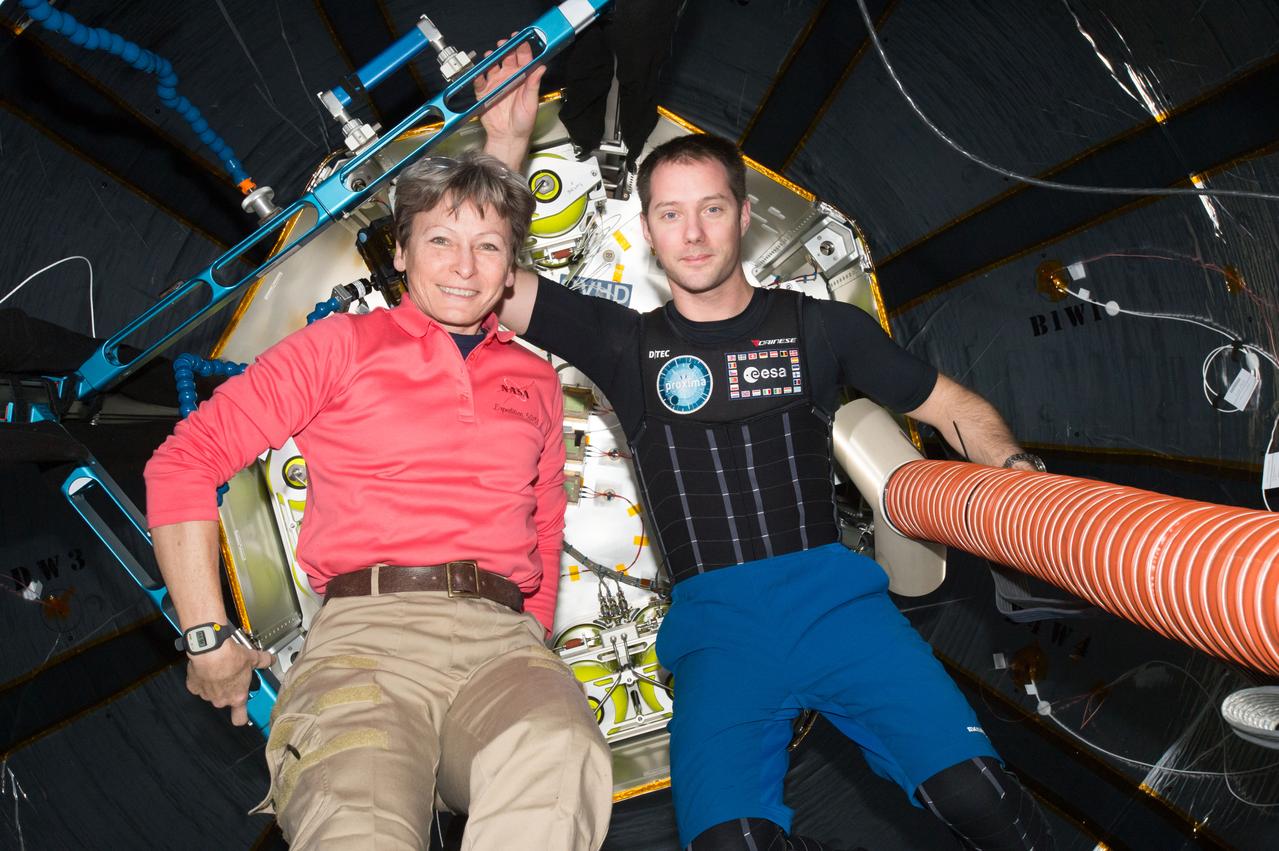 iss050e037906 (02/02/2017) --- NASA astronaut Peggy Whitson (left) and ESA (European Space Agency) astronaut Thomas Pesquet are photographed inside the Bigelow Expandable Activity Module, or BEAM. BEAM is an experimental expandable module attached to the station. Expandable habitats could greatly decrease the amount of transport volume for future space missions. These “expandables” weigh less and take up less room than traditional rigid metal habitats on a rocket while allowing additional space for living and working. They also provide protection from solar and cosmic radiation, space debris, and other contaminants. Crews traveling to the moon, Mars, asteroids, or other destinations could potentially use them as habitable structures.