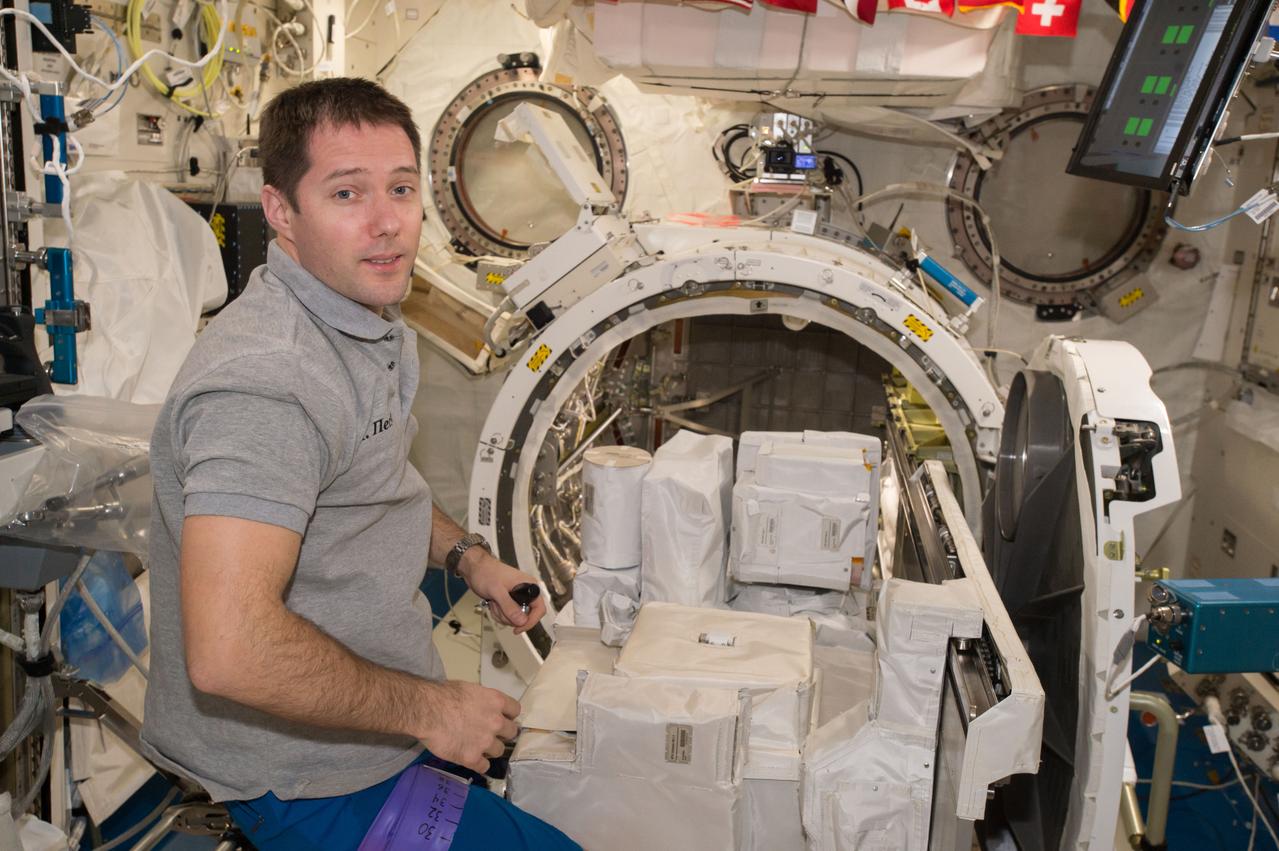 iss050e039213 (2/7/2017) --- European Space Agency (ESA) astronaut Thomas Pesquet during the installation of the Japanese Experiment Module (JEM) High Definition Television (HDTV) to Exposed Facility Unit (EFU) Adapter on JEM Airlock (JEMAL) Slide Table. The High Definition Television Camera-Exposed Facility 2 (HDTV-EF2) is a high-definition television camera system that is used for Earth observation from the International Space Station (ISS). HDTV-EF2 is exposed to the space environment on the Japanese Experiment Module -Exposed Facility (JEM-EF).