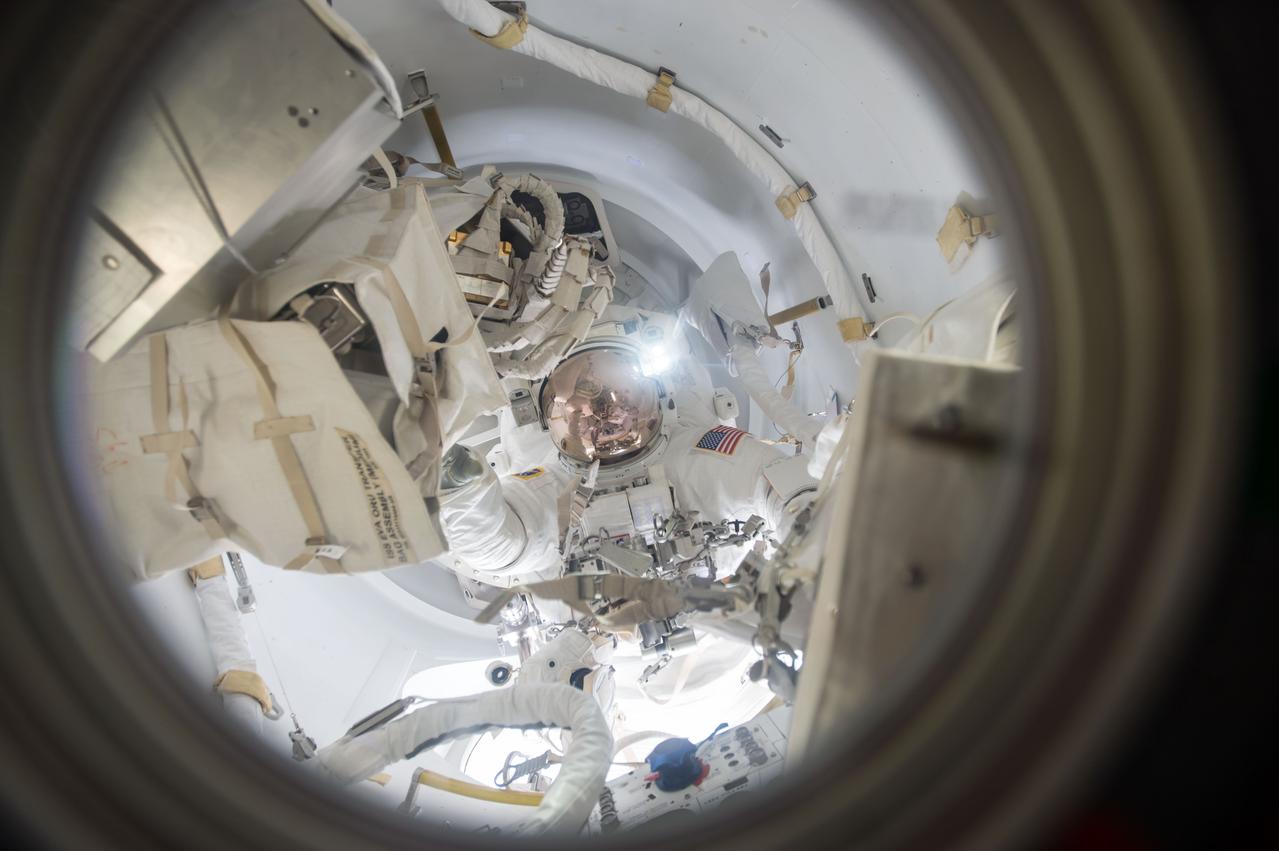 iss050e059613 (03/24/2017) --- Expedition 50 Commander Shane Kimbrough of NASA is seen floating into the Quest airlock at the conclusion of a spacewalk. Kimbrough and Flight Engineer Thomas Pesquet of ESA (European Space Agency) conducted a six hour and 34 minute spacewalk on March 24, 2017. The two astronauts successfully disconnected cables and electrical connections on the Pressurized Mating Adapter-3 to prepare for its robotic move, lubricated the latching end effector on the Special Purpose Dexterous Manipulator “extension” for the Canadarm2 robotic arm, inspected a radiator valve and replaced cameras on the Japanese segment of the outpost.