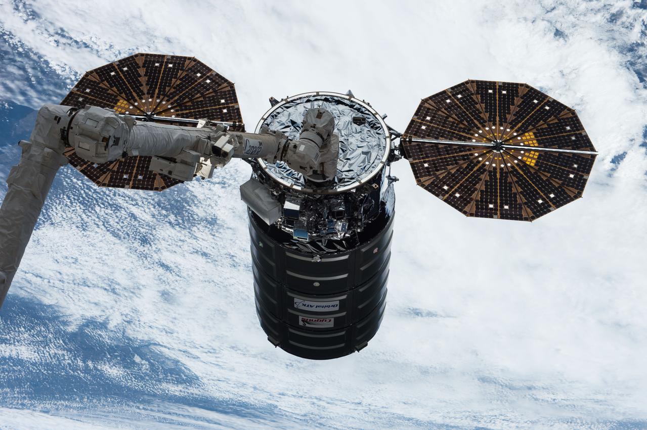 iss051e020754 (April 22, 2017) --- The Cygnus resupply ship from Orbital ATK is in the grips of the Canadarm2 robotic arm prior to its installation on the Unity module at the International Space Station on April 22, 2017.