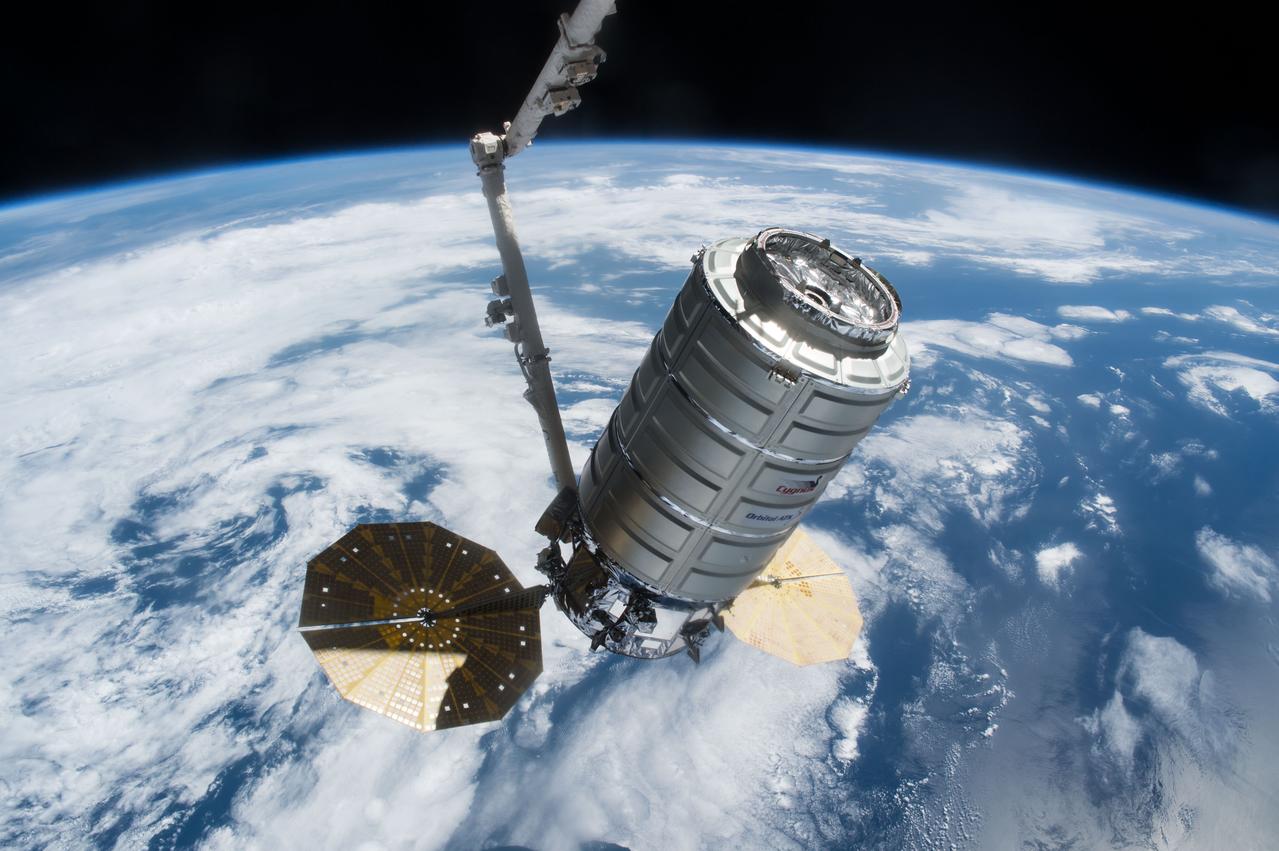 iss051e020824 (April 22, 2018) --- The Orbital ATK Cygnus resupply ship is pictured in the grips of the Canadarm2 robotic arm shortly after its capture in April of 2017 during Expedition 51.