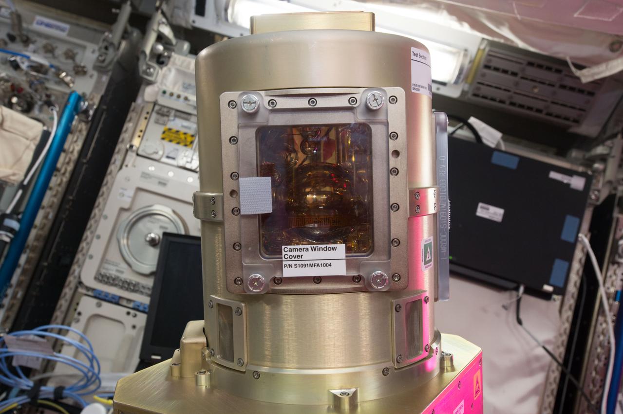 iss051e028301 (4/25/2017) --- A view of the Zero Boil-Off Tank (ZBOT) experiment Vacuum Jacket Camera Window Cover hardware.  Zero Boil-Off Tank (ZBOT) uses an experimental fluid to test active heat removal and forced jet mixing as alternative means for controlling tank pressure for volatile fluids. Results from the investigation improve models used to design tanks for long-term cryogenic liquid storage, which are essential in biotechnology, medicine, industrial, and many other applications on Earth.