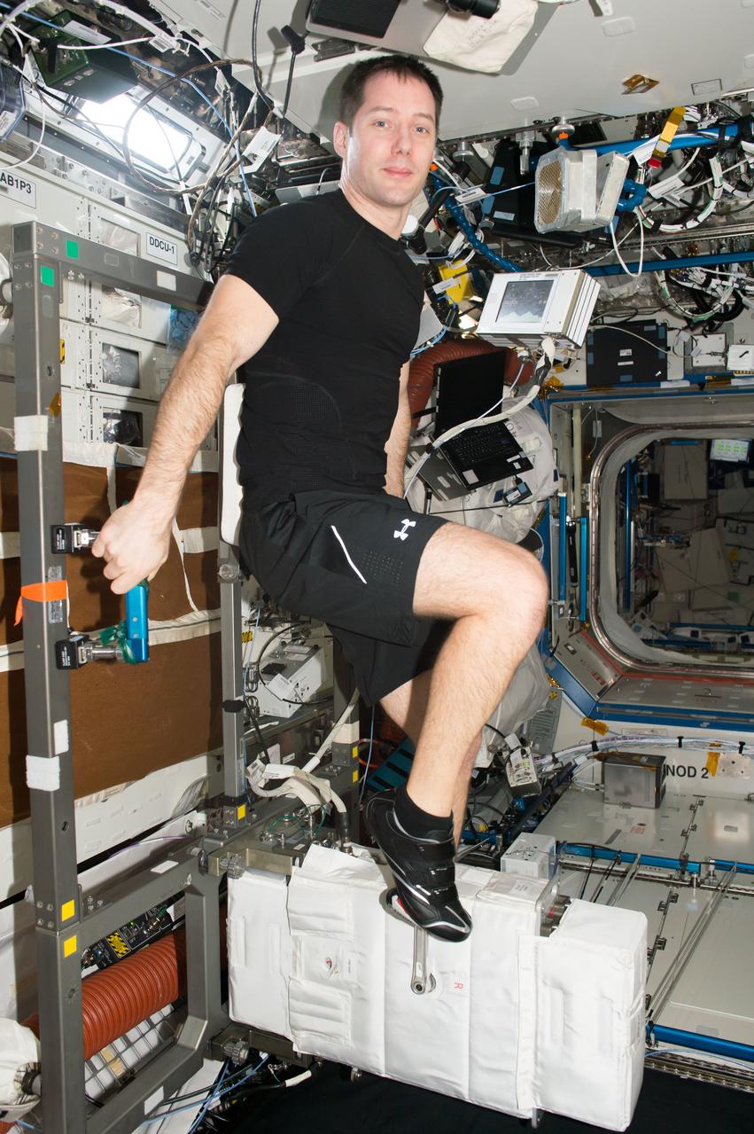 iss051e029335 (April 30, 2017) --- European Space Agency astronaut Thomas Pesquet exercises on the Cycle Ergometer with Vibration Isolation and Stabilization System (CEVIS), the station’s exercise bike, inside the Destiny laboratory module.