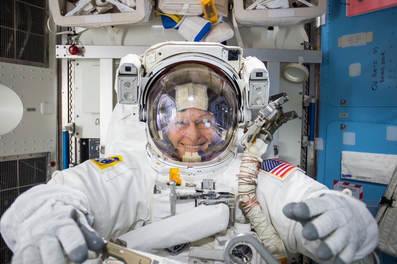 iss051e041836 (05/12/2017) -- NASA astronaut Peggy Whitson is seen prior to the 200th spacewalk in support of the International Space Station. Expedition 51 Commander Peggy Whitson and Flight Engineer Jack Fischer of NASA successfully replaced a large avionics box that supplies electricity and data connections to the science experiments. The astronauts also completed additional tasks to install a connector that will route data to the Alpha Magnetic Spectrometer, repair insulation at the connecting point of the Japanese robotic arm, and install a protective shield on the Pressurized Mating Adapter-3. This adapter will host a new international docking port for the arrival of commercial crew spacecraft.