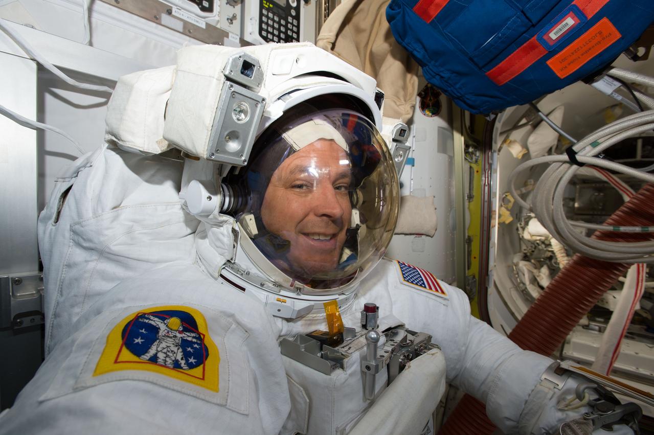 iss051e048878 (May 23, 2017) --- Air Force colonel and NASA astronaut Jack "2Fish" Fischer is suited up in a U.S. spacesuit inside the crew lock portion of the U.S. Quest airlock preparing to exit the International Space Station on a contigency spacewalk.