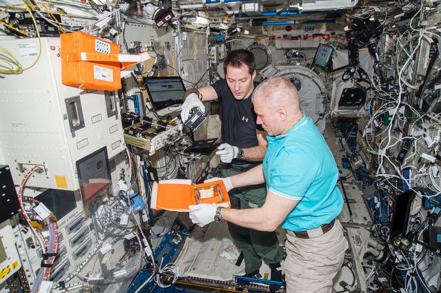 NASA image: Pesquet and Novitskiy conduct JAXA PCG Canister Removal