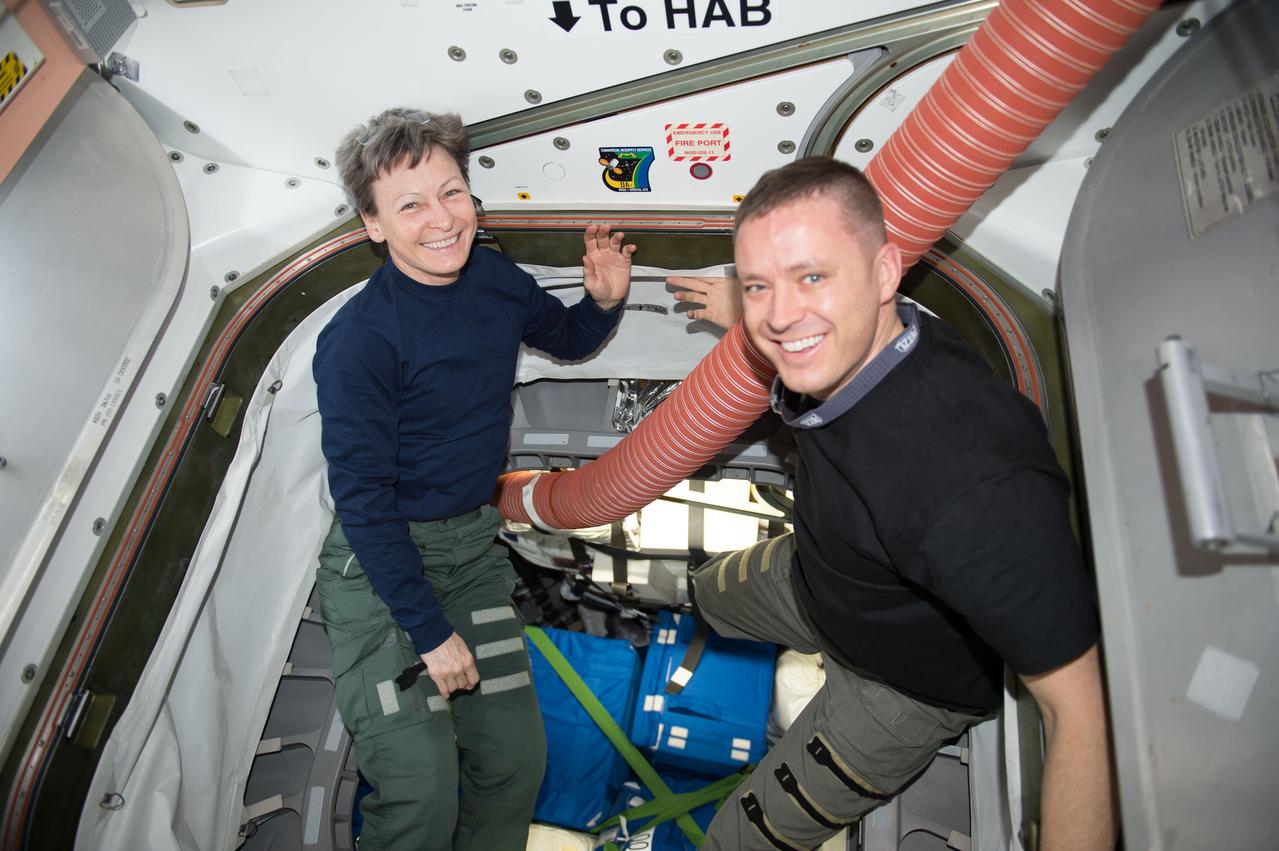 iss052e002382 (June 3, 2017) --- NASA astronauts Peggy Whitson and Jack Fischer are pictured packing up gear inside the International Space Station.