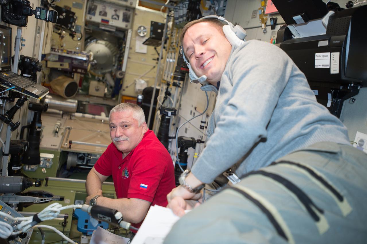 iss052e003889 (June 6, 2017) --- Expedition 52 crew members Fyodor Yurchikhin (left) and Jack Fischer are seen working inside the Zvezda service module.