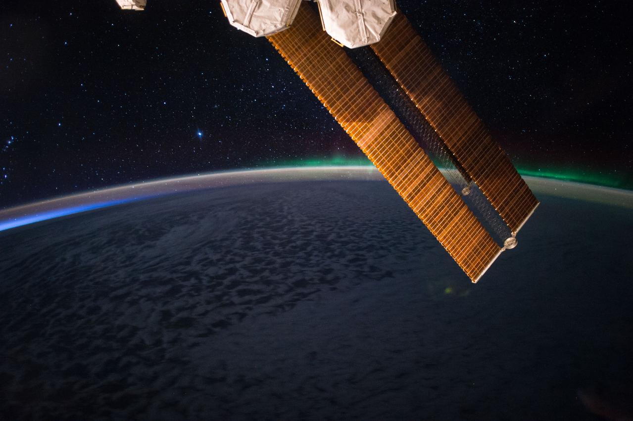 iss052e004998 (June 19, 2017) --- The aurora and the starry night are pictured above Earth’s atmosphere in this photograph taken from the space station’s cupola June 19, 2017.