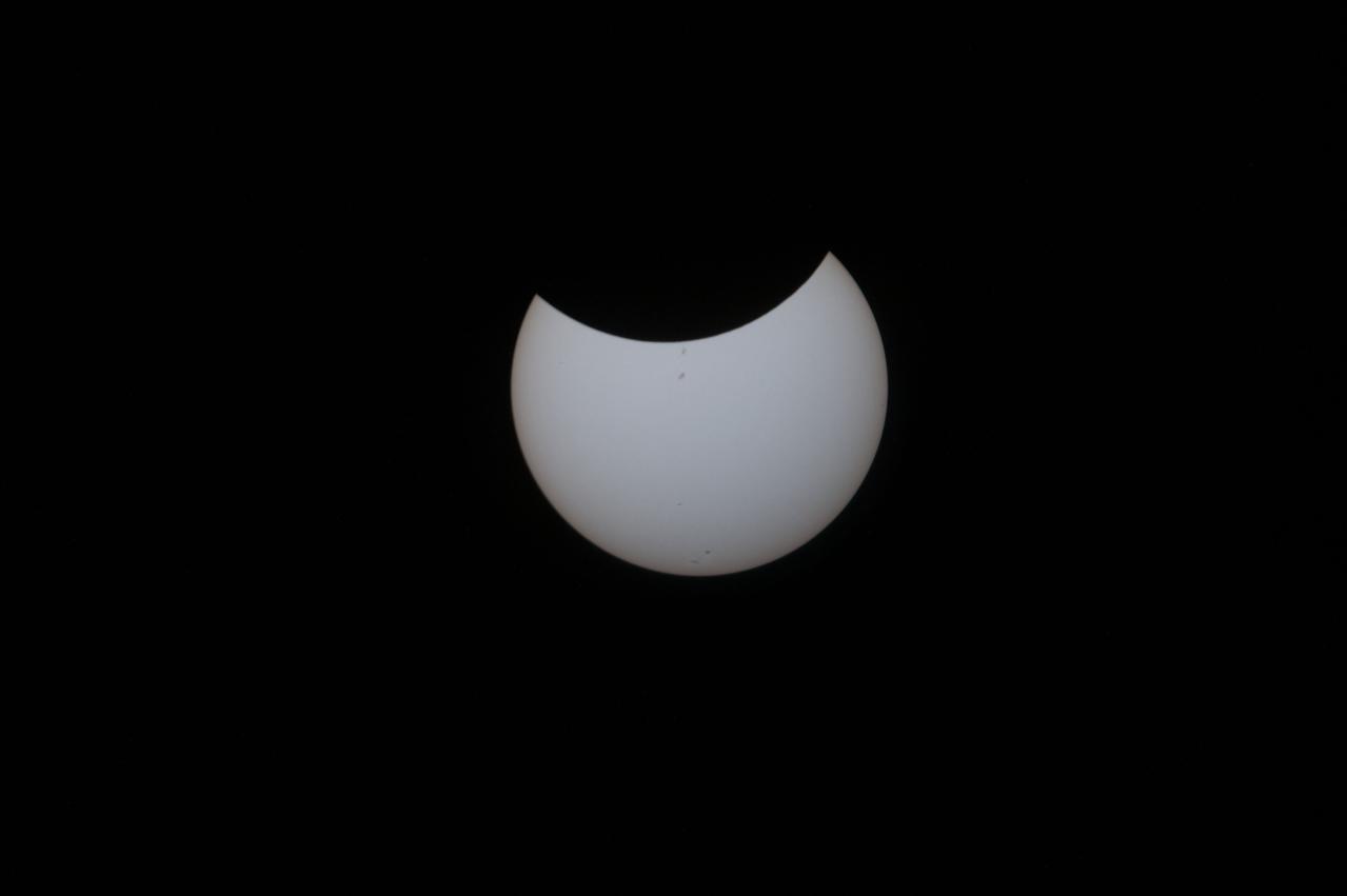 iss052e055885 (Aug. 21, 2017) --- Aboard the International Space Station, NASA Flight Engineer Randy Bresnik took still images of the eclipse as seen from the unique vantage of the Expedition 52 crew. Witnessing the eclipse from orbit with Bresnik were NASA’s Jack Fischer and Peggy Whitson, ESA (European Space Agency’s) Paolo Nespoli, and Roscosmos’ Commander Fyodor Yurchikhin and Sergey Ryazanskiy. The space station crossed the path of the eclipse three times as it orbited above the continental United States at an altitude of 250 miles.