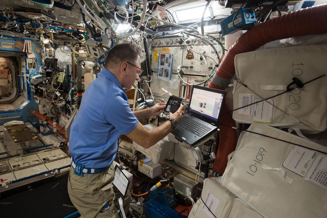 iss052e058906 (8/18/2017) --- European Space Agency (ESA) astronaut Paolo Nespoli collects and processes saliva samples in the bioanalyzer for the ISS Non-invasive Sample Investigation and Results Transmission to ground with the Utmost easiness (In Situ). Crew on the International Space Station (ISS) are continually monitored for health changes, and as part of these measurements, they take saliva samples that are stored and returned to Earth later. The ISS Non-invasive Sample Investigation and results Transmission to ground with the Utmost easiness (IN SITU) bioanalysis is a portable device that can check crew members’ saliva on board, enabling direct real-time analysis. The device’s first uses are to monitor stress levels and appetites among crew members