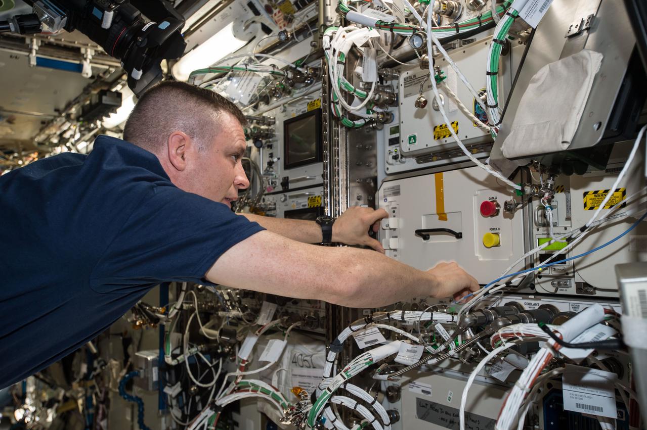 iss052e073850 (Aug. 25, 2017) --- NASA astronaut Jack Fischer installs hardware Biological Research In Canisters - Light Emitting Diode (BRIC-LED) for future experiments investigating seedling, microbial, or fungal growth.