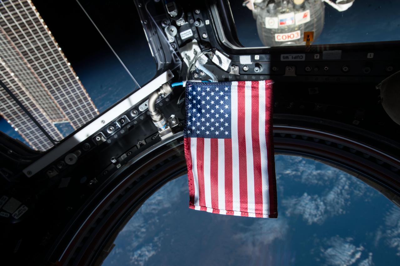View of Expedition 53 crewmember's Personal Flight Data Filer (FDF) item- US Flag- Floating.  Image was released by astronaut on social media.