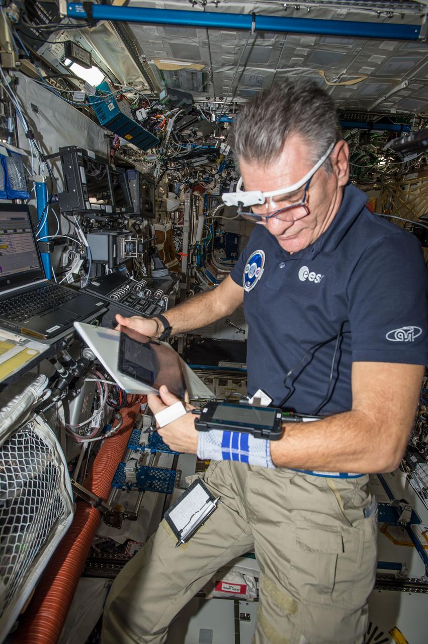 iss053e061054 (9/29/2017) --- European Space Agency (ESA) astronaut Paolo Nespoli, setting up the Mobile Procedure Viewer (MobiPV), in the U.S. Laboratory aboard the International Space Station (ISS). The Mobile Procedure Viewer (mobiPV) experiment demonstrates new technologies and operations concepts for ISS crew procedure execution as task support, both for on board crew, and for the supporting ground expert team.