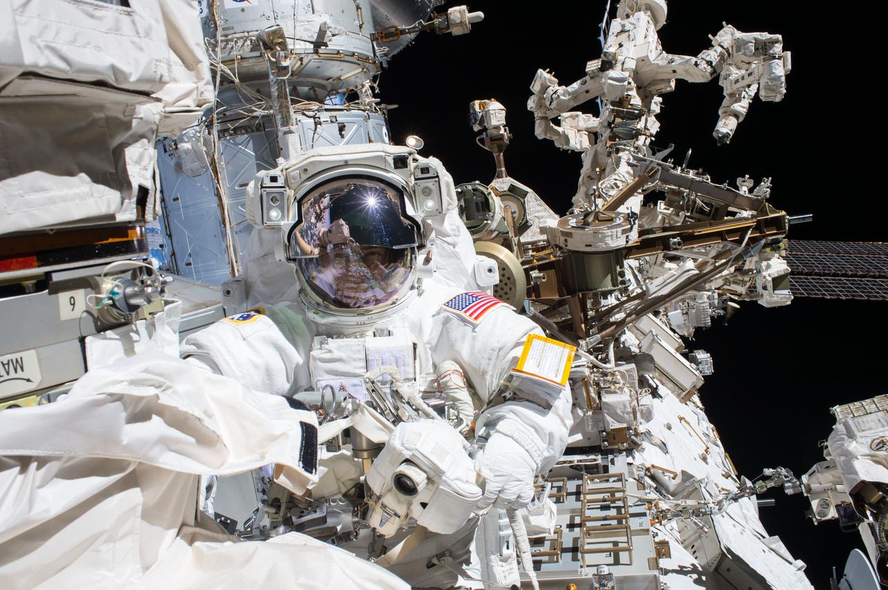 iss053e079156 (Oct. 5, 2017) --- NASA astronaut and Expedition 53 Flight Engineer Mark Vande Hei is pictured during a spacewalk to service components on the Canadarm2 robotic arm during a spacewalk with NASA astronaut Randy Bresnik (out of frame).