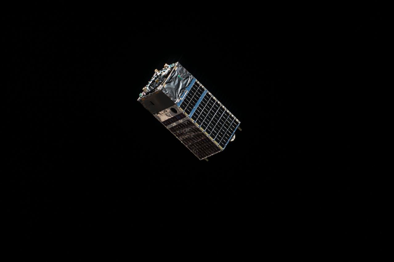 iss053e130267 (Oct. 24, 2017) --- The Kestrel Eye IIM (KE2M) CubeSat is pictured shortly after it was deployed from the tip of the Dextre attached to the Mobile Servicing System. The KE2M is carrying an optical imaging system payload that is being used to validate the concept of using microsatellites in low-Earth orbit to support critical operations.