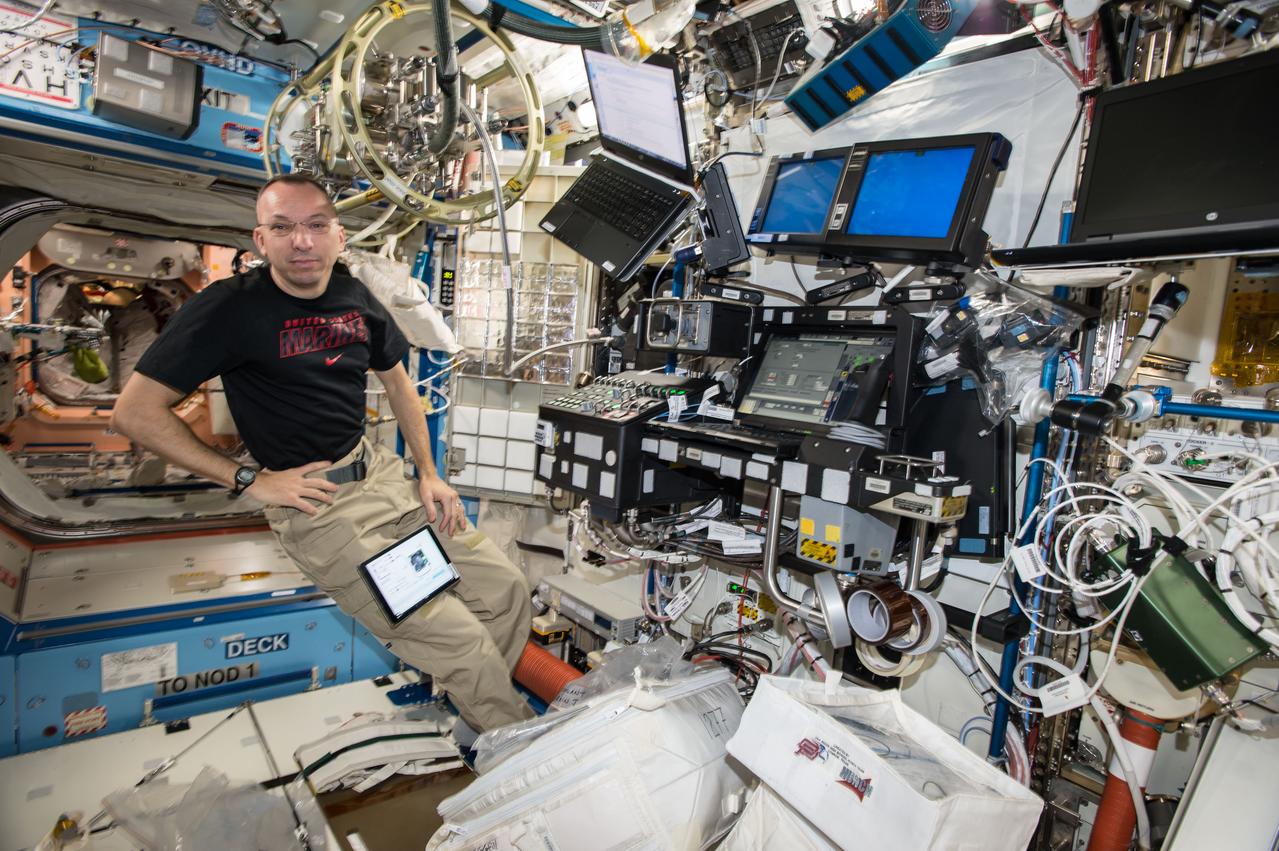iss053e156160 (Nov. 9, 2017) --- Expedition 53 Commander Randy Bresnik is at the controls of the robotics workstation in the Destiny laboratory module training for the approach, rendezvous and grapple of the Orbital ATK Cygnus resupply ship. He and Flight Engineer Paolo Nespoli were in the cupola operating the Canadarm2 robotic arm to grapple Cygnus when it arrived Nov. 14, 2017, delivering nearly 7,400 pounds of crew supplies, science experiments, computer gear, vehicle equipment and spacewalk hardware.